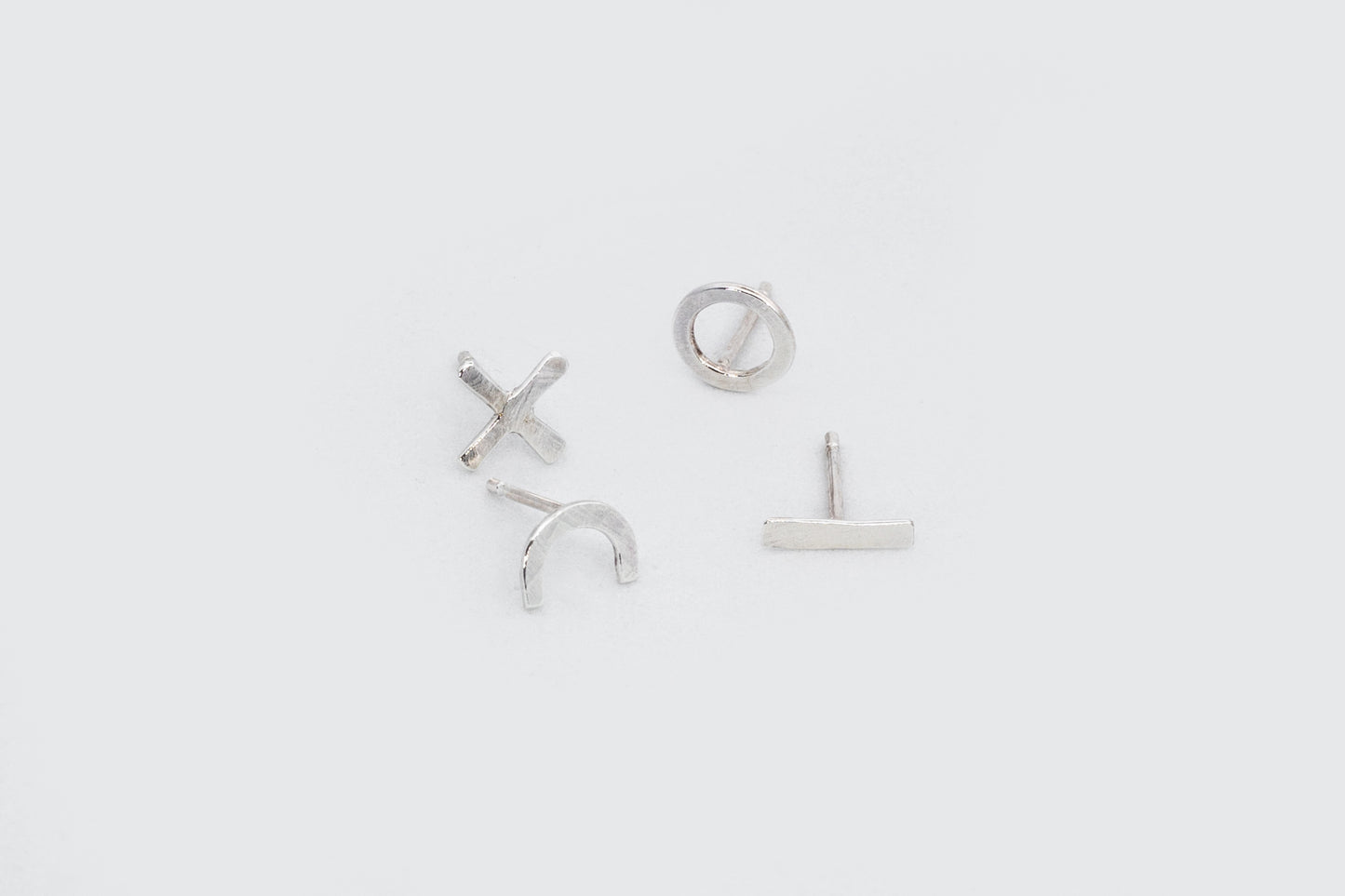 PENDIENTES CUATRO GEOMÉTRICOS PLATA